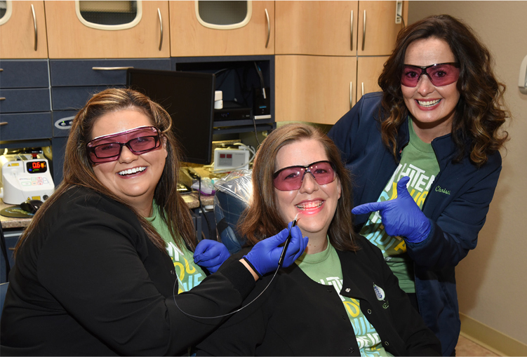 Laser dentistry techniques like gum contouring help patients in Rockwall.