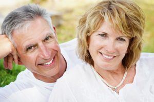 Older couple with beautiful dental implants in Rockwall, TX.