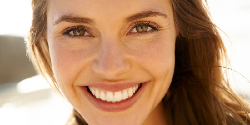 closeup of a beautiful woman with a confident smile