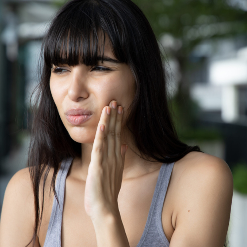 woman with tooth pain needs emergency dentistry for severe toothache in rockwall tx