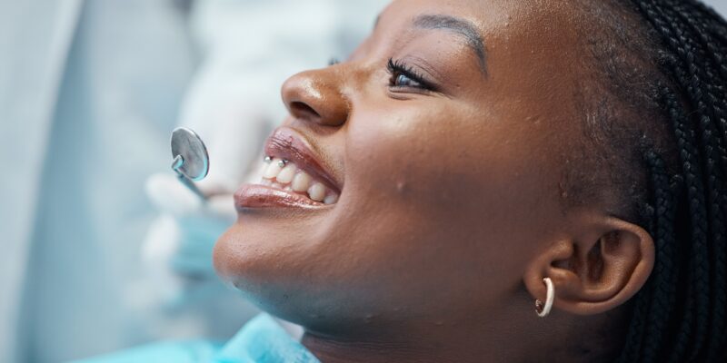 closeup, young Black woman at the dentist, gum exam